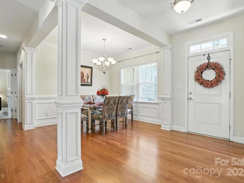 8275 Normandy Road, Denver, NC 28037.  MLS# CAR4276135, YatesRealty ID 23508. The dining room is flanked by elegant columns.