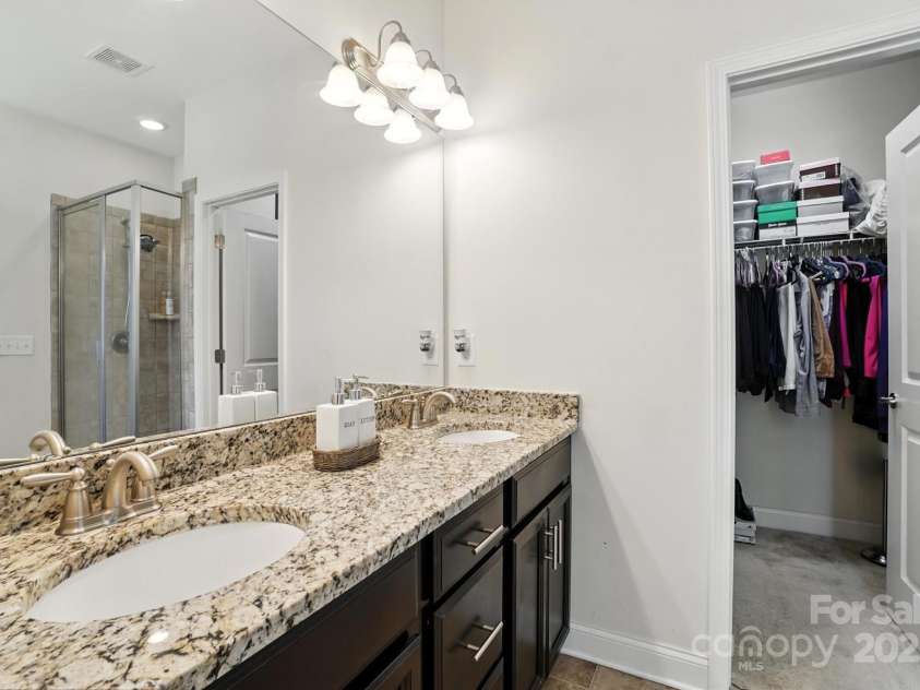 8275 Normandy Road, Denver, NC 28037.  MLS# CAR4276135, YatesRealty ID 23508. The en-suite bath offers dual vanities.