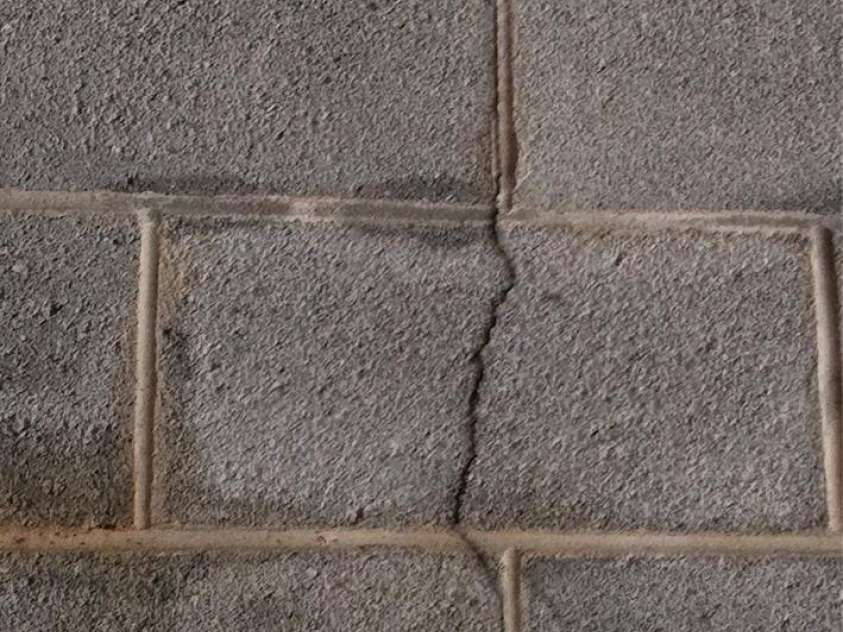 6490 Globe Road, Lenoir, NC 28645.  MLS# CAR4281988, YatesRealty ID 2351. Crack in block