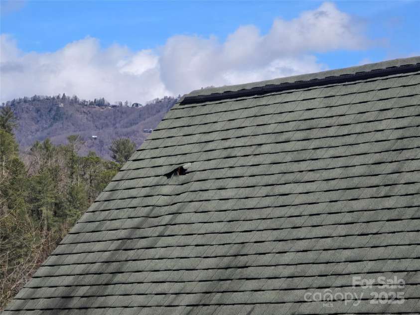 6490 Globe Road, Lenoir, NC 28645.  MLS# CAR4281988, YatesRealty ID 2351. Damage from hole shot in roof, interior