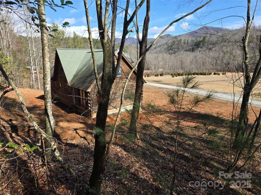 6490 Globe Road, Lenoir, NC 28645.  MLS# CAR4281988, YatesRealty ID 2351. Looking down to house from further up on the land