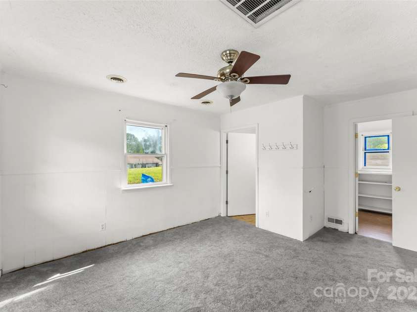 493 Dogwood Road, Candler, NC 28715.  MLS# CAR4257818, YatesRealty ID 23510. Ensuite Primary with large walk-in closet