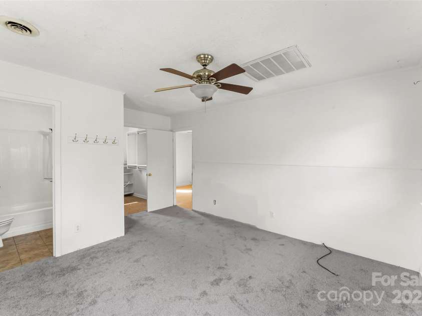 493 Dogwood Road, Candler, NC 28715.  MLS# CAR4257818, YatesRealty ID 23510. Ensuite Primary with large walk-in closet