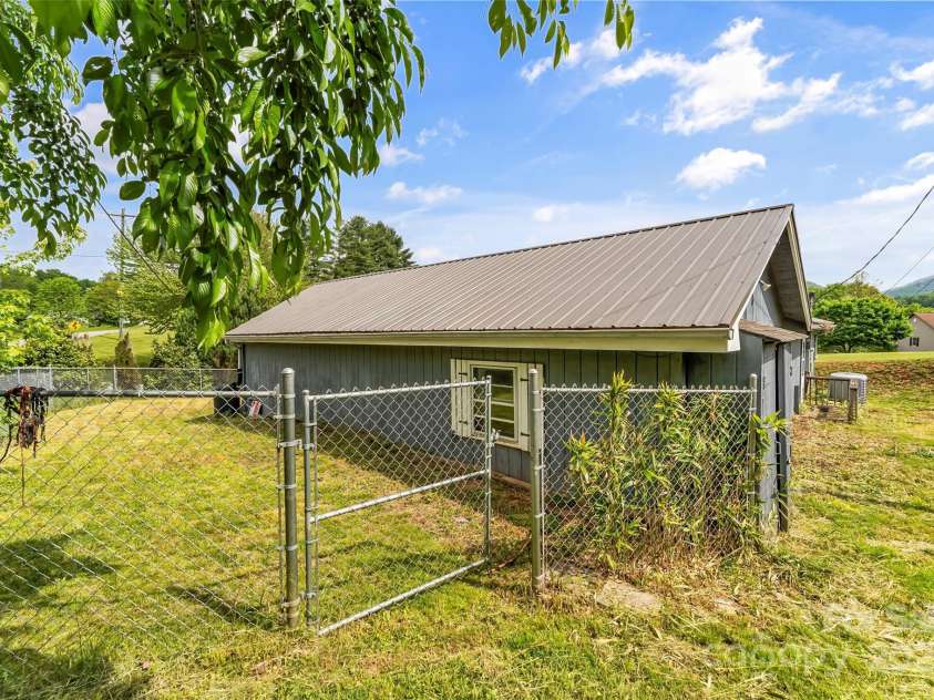 493 Dogwood Road, Candler, NC 28715.  MLS# CAR4257818, YatesRealty ID 23510. Fenced in front and side yard