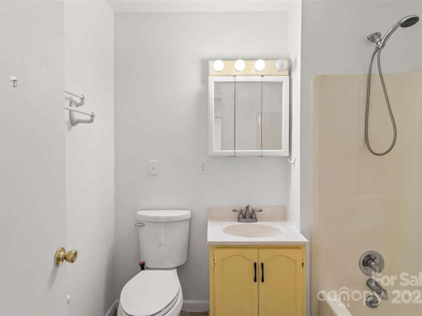 493 Dogwood Road, Candler, NC 28715.  MLS# CAR4257818, YatesRealty ID 23510. Hall Bathroom