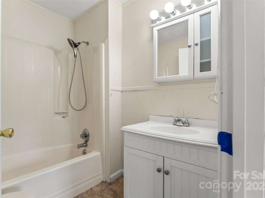 493 Dogwood Road, Candler, NC 28715.  MLS# CAR4257818, YatesRealty ID 23510. Primary Bathroom (new vanity and paint since photo)