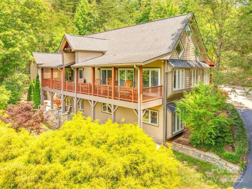 65 Hillcrest Drive, Weaverville, NC 28787.  MLS# CAR4275915, YatesRealty ID 23514. Beautifully landscaped, ipe decking and sits back from the road with a gentle grade driveway