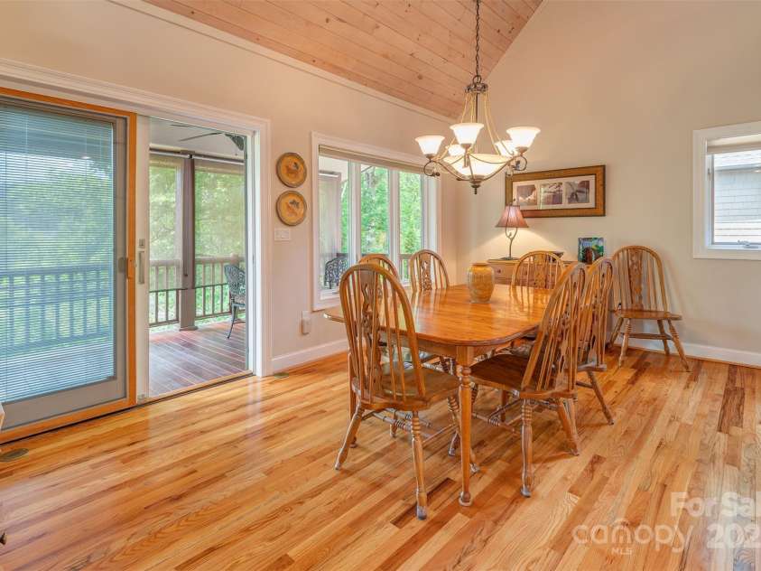 65 Hillcrest Drive, Weaverville, NC 28787.  MLS# CAR4275915, YatesRealty ID 23514. Dining room also has access to covered front deck