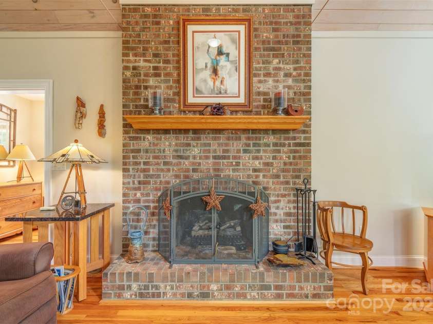 65 Hillcrest Drive, Weaverville, NC 28787.  MLS# CAR4275915, YatesRealty ID 23514. Gas vented fireplace with brick hearth