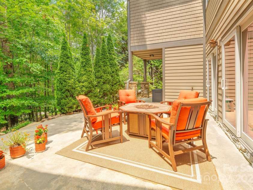 65 Hillcrest Drive, Weaverville, NC 28787.  MLS# CAR4275915, YatesRealty ID 23514. Lower level patio with access to three full bedrooms