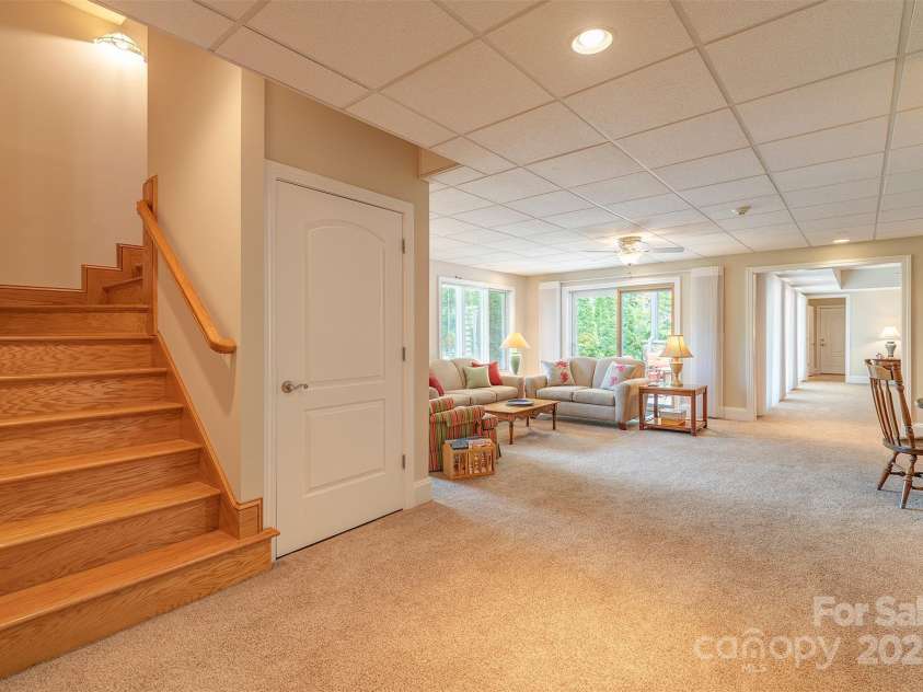 65 Hillcrest Drive, Weaverville, NC 28787.  MLS# CAR4275915, YatesRealty ID 23514. Stairs from kitchen lead to lower level