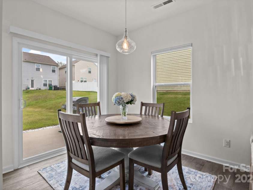 1207 Skyflower Way, Charlotte, NC 28214.  MLS# CAR4269220, YatesRealty ID 23518. Dining area w/ sliders to rear yard