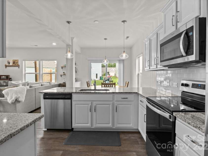 1207 Skyflower Way, Charlotte, NC 28214.  MLS# CAR4269220, YatesRealty ID 23518. Kitchen opens to dining and living spaces