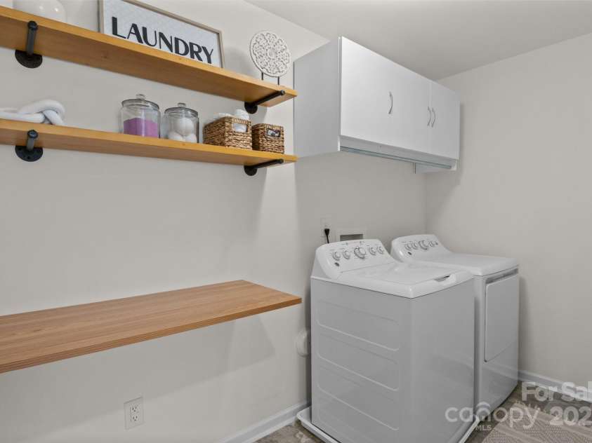 1207 Skyflower Way, Charlotte, NC 28214.  MLS# CAR4269220, YatesRealty ID 23518. Large laundry room w/ storage