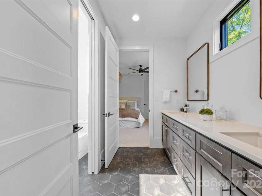 3304 Mar Vista Circle, Charlotte, NC 28209.  MLS# CAR4269142, YatesRealty ID 23531. Jack and Jill bath with dual vanity, separate toilet and shower area with pocket door, operable skylight, walk in shower