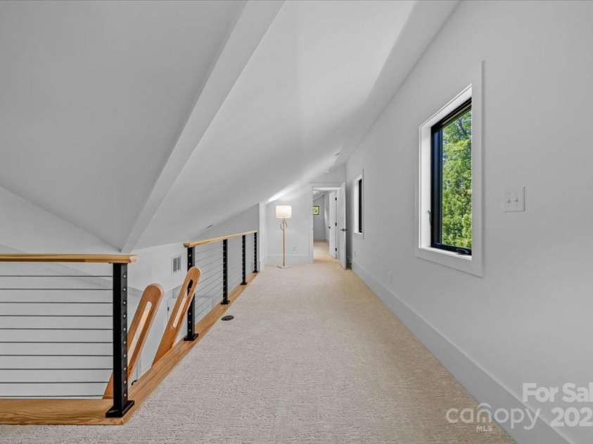 3304 Mar Vista Circle, Charlotte, NC 28209.  MLS# CAR4269142, YatesRealty ID 23531. Loft space between the upper lever bedrooms includes windows and closet access for additional storage