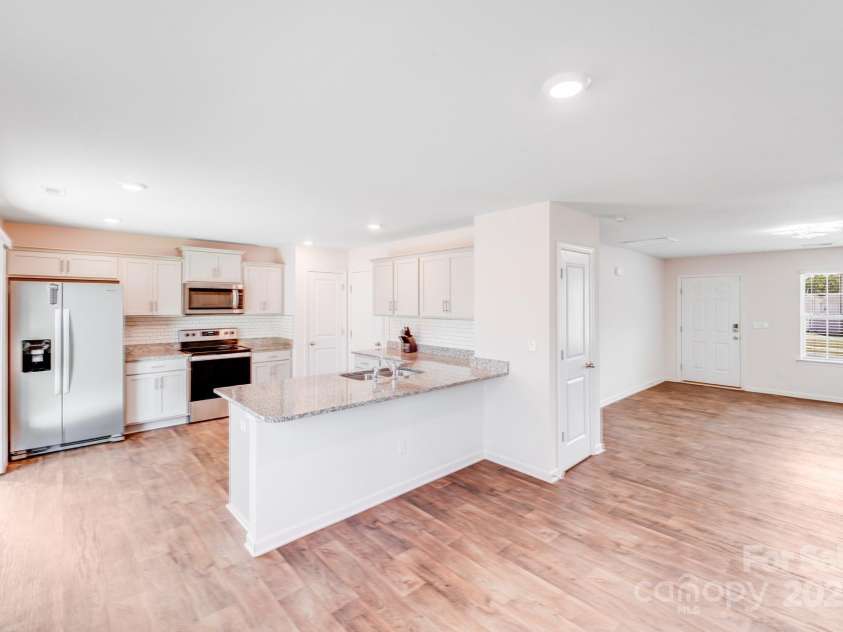 7205 Finnigan Road, Charlotte, NC 28215.  MLS# CAR4257319, YatesRealty ID 23532. Large Open Kitchen w/ Large Island