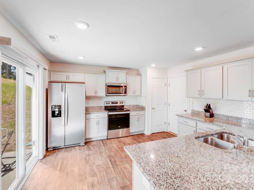 7205 Finnigan Road, Charlotte, NC 28215.  MLS# CAR4257319, YatesRealty ID 23532. Slide glass Patio Door