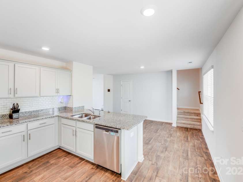 7205 Finnigan Road, Charlotte, NC 28215.  MLS# CAR4257319, YatesRealty ID 23532. Staircase to access the uppler level