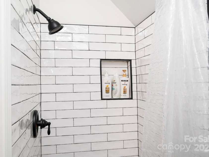 25 Licklog Ridge Road, Fairview, NC 28730.  MLS# CAR4256398, YatesRealty ID 23533. Guest Bath Tiled Shower