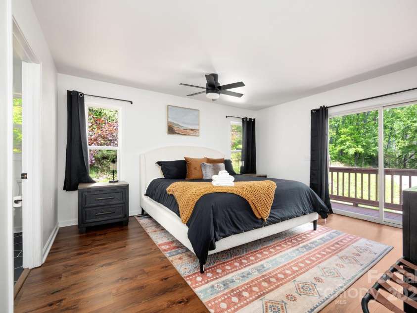 25 Licklog Ridge Road, Fairview, NC 28730.  MLS# CAR4256398, YatesRealty ID 23533. Primary Bedroom Has Deck Access