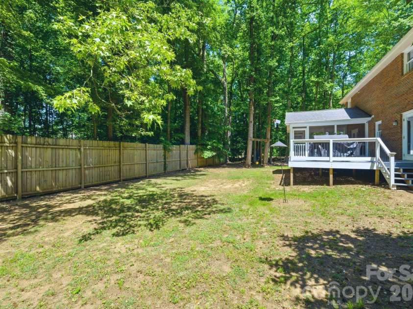 6217 Eagle Claw Court, Mint Hill, NC 28227.  MLS# CAR4382735, YatesRealty ID 23540. Privacy Fence along Backyard