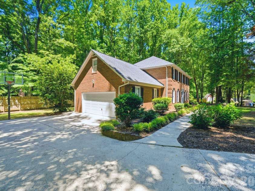 6217 Eagle Claw Court, Mint Hill, NC 28227.  MLS# CAR4382735, YatesRealty ID 23540. Side Load Garage with Basketball Goal