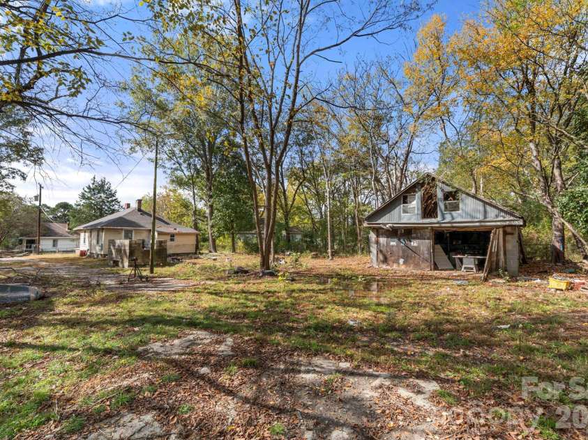 224 Bush Street, Gastonia, NC 28056.  MLS# CAR4377911, YatesRealty ID 23542. View from back yard - house and workshop