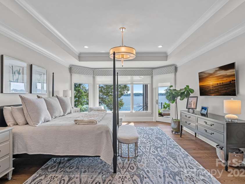 18007 Harbor Light Boulevard, Cornelius, NC 28031.  MLS# CAR4271847, YatesRealty ID 23544. Wake up every morning with expansive Waterfront views from this beautiful, elegant and spacious Primary Suite!