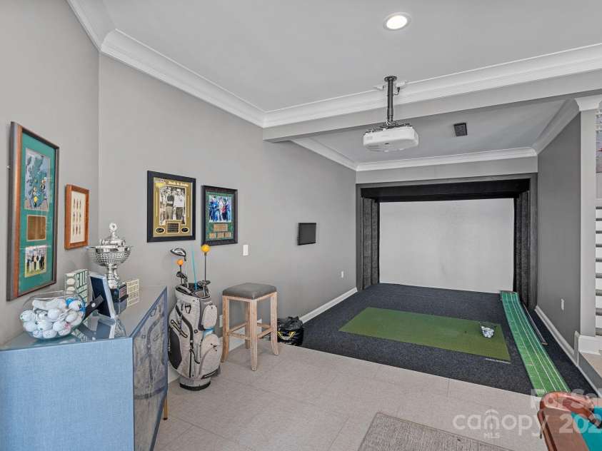 18007 Harbor Light Boulevard, Cornelius, NC 28031.  MLS# CAR4271847, YatesRealty ID 23544. Who wouldn't love coming over and practicing their golf skills on a private Golf Simulator!