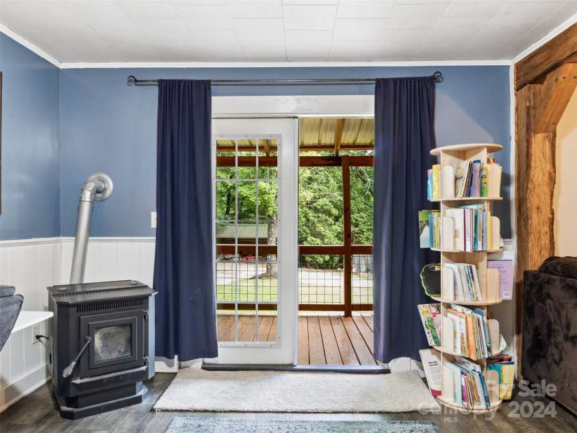 19314 Highway 221 Highway, Marion, NC 28752.  MLS# CAR4162448, YatesRealty ID 2355. Greatroom with pellet stove