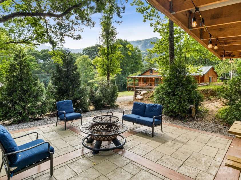 19314 Highway 221 Highway, Marion, NC 28752.  MLS# CAR4162448, YatesRealty ID 2355. Stamped concrete patio at the outdoor kitchen