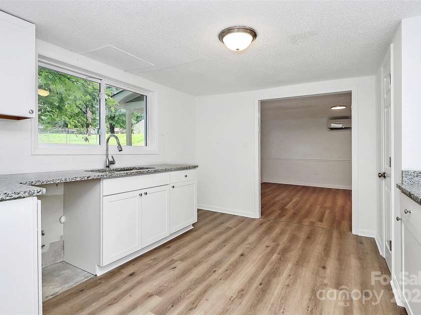 613 Rhyne Street, Gastonia, NC 28054.  MLS# CAR4261115, YatesRealty ID 23552. Fully renovated basement kitchen