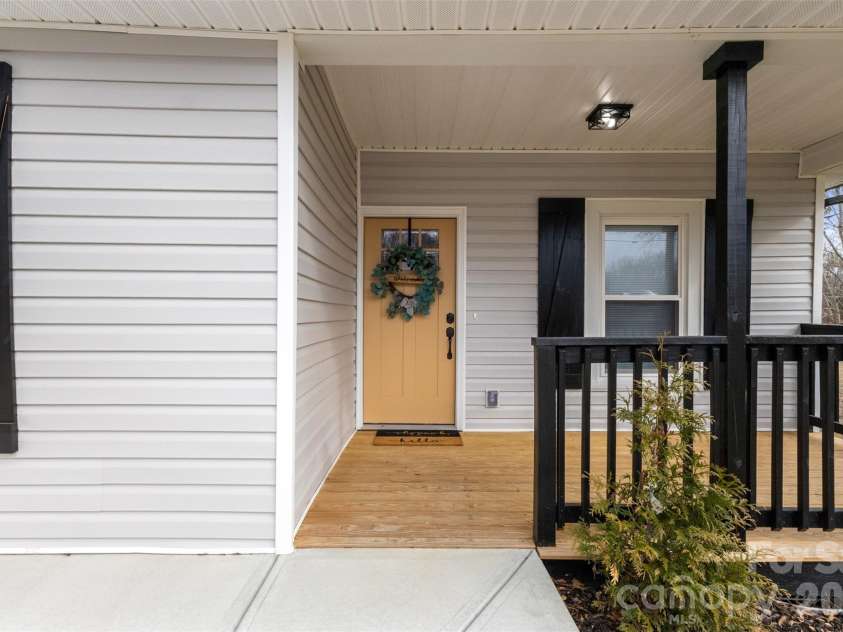 305 Henry Street, Belmont, NC 28012.  MLS# CAR4340496, YatesRealty ID 23556. Front porch w/ brand new wood and siding