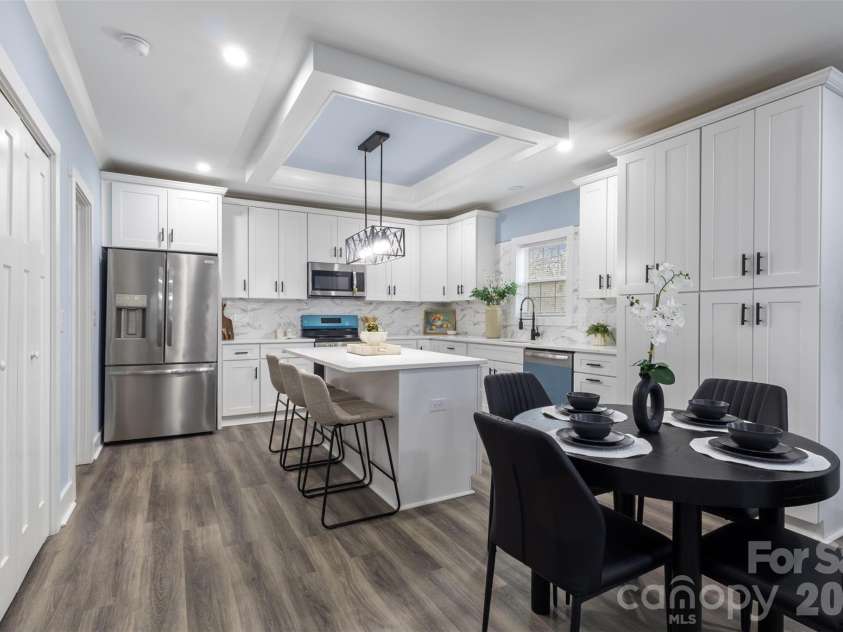 305 Henry Street, Belmont, NC 28012.  MLS# CAR4340496, YatesRealty ID 23556. Open living area view into kitchen 