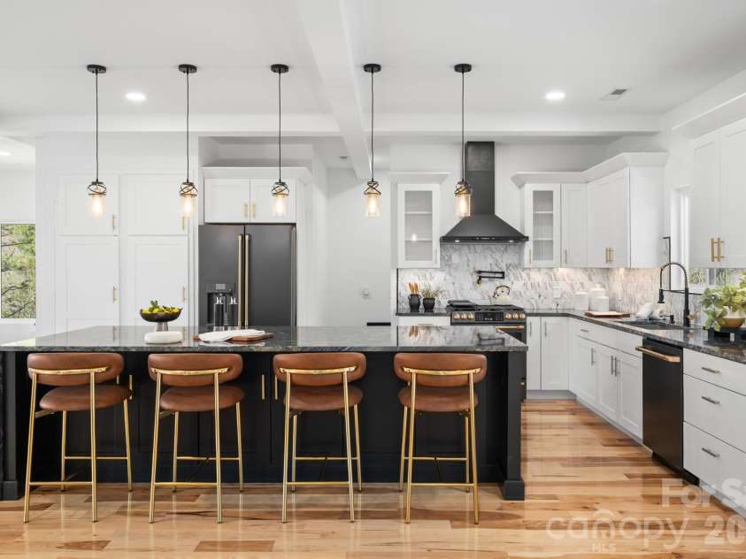 74 Jeranna Road, Mills River, NC 28759.  MLS# CAR4354656, YatesRealty ID 23556. Cabinets built under the breakfast bar