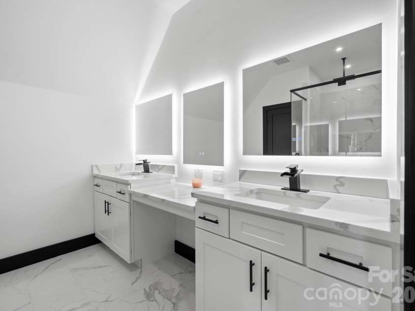 74 Jeranna Road, Mills River, NC 28759.  MLS# CAR4354656, YatesRealty ID 23556. En suite bathroom with dual sink vanity