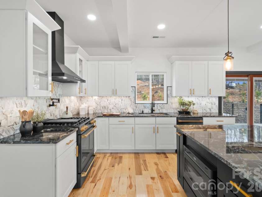 74 Jeranna Road, Mills River, NC 28759.  MLS# CAR4354656, YatesRealty ID 23556. Hands free range hood and kitchen faucet