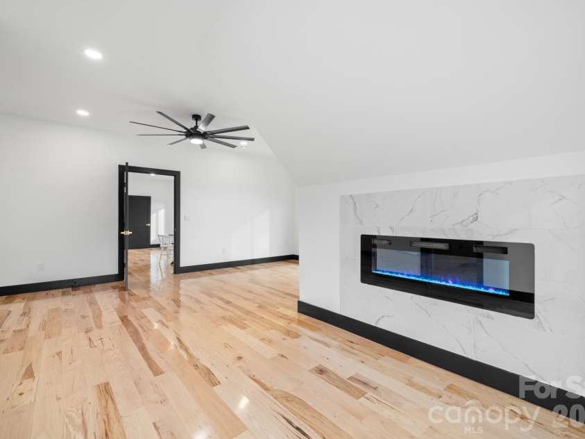 74 Jeranna Road, Mills River, NC 28759.  MLS# CAR4354656, YatesRealty ID 23556. Third bedroom with electric fireplace