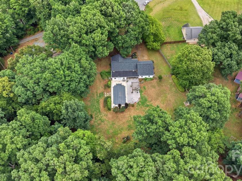 1919 Gables Drive, Monroe, NC 28112.  MLS# CAR4380322, YatesRealty ID 23557. 1.2 acres surrounded by trees