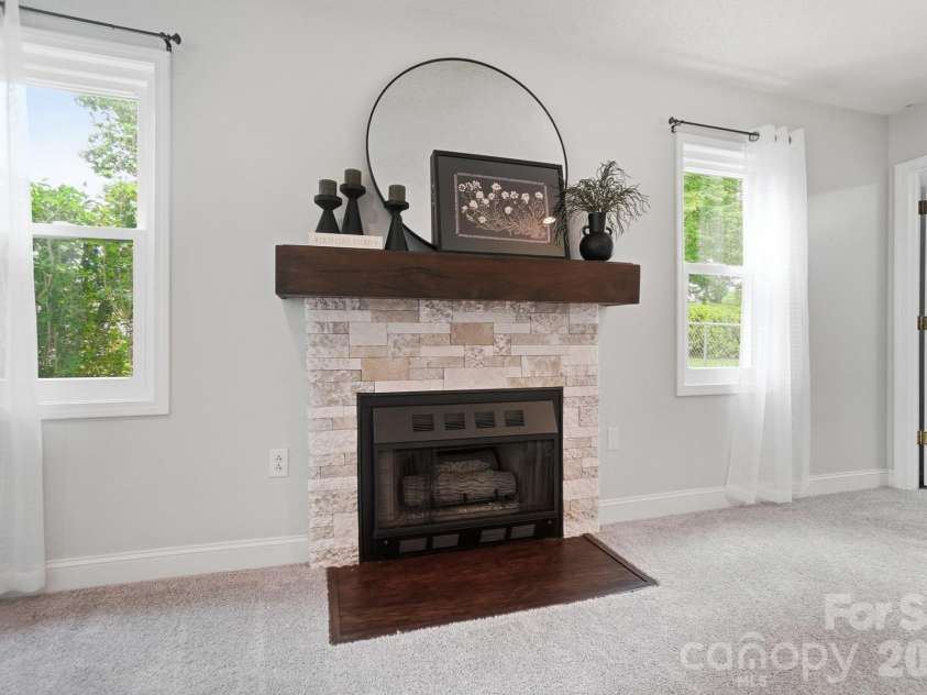 1919 Gables Drive, Monroe, NC 28112.  MLS# CAR4380322, YatesRealty ID 23557. Gas fireplace with stone