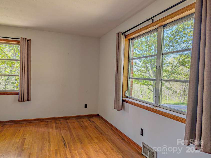 56 Gill Branch Road, Weaverville, NC 28787.  MLS# CAR4270678, YatesRealty ID 23563. Catch a glimpse of the views and see the sunset from your bedroom.