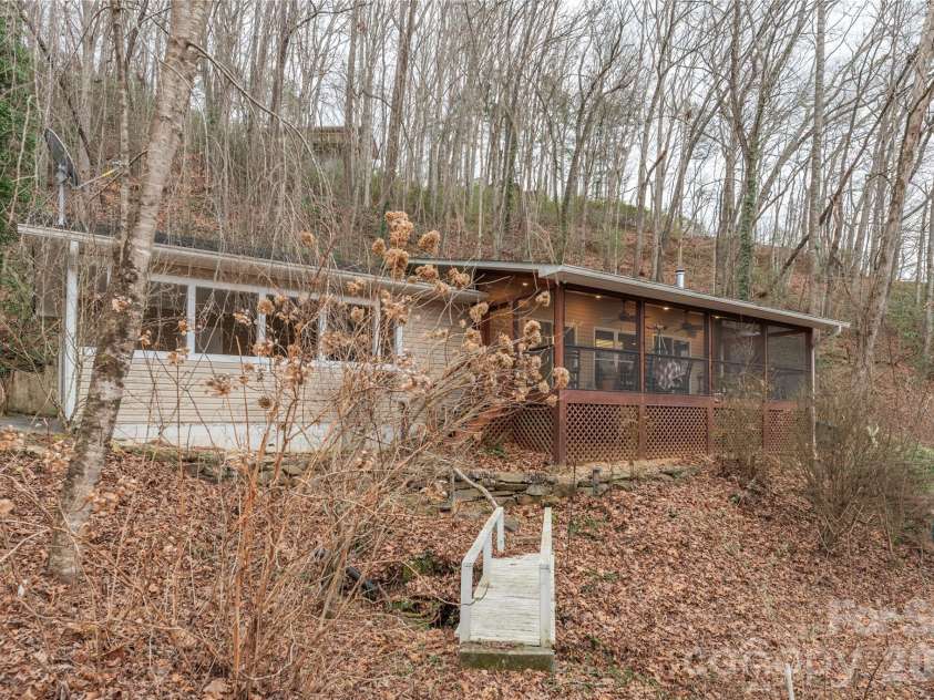 12 Bear Cove Lane, Bryson City, NC 28713.  MLS# CAR4337192, YatesRealty ID 2358. Additional exterior view of creek and bridge