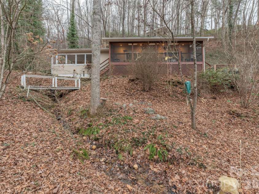 12 Bear Cove Lane, Bryson City, NC 28713.  MLS# CAR4337192, YatesRealty ID 2358. Creek begins with a small waterfall for water sounds from the deck