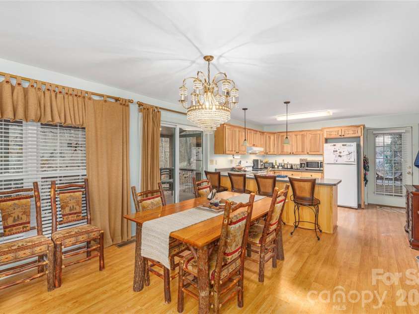 12 Bear Cove Lane, Bryson City, NC 28713.  MLS# CAR4337192, YatesRealty ID 2358. Dining area with chandelier
