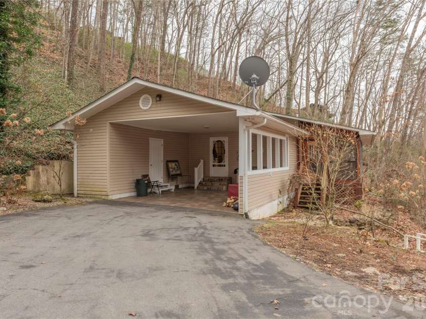 12 Bear Cove Lane, Bryson City, NC 28713.  MLS# CAR4337192, YatesRealty ID 2358. Driveway and carport
