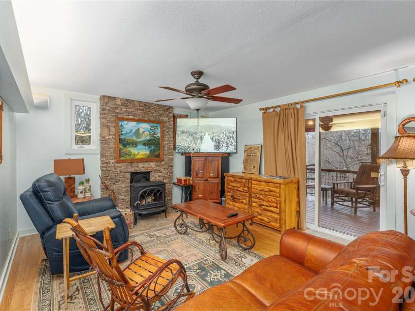 12 Bear Cove Lane, Bryson City, NC 28713.  MLS# CAR4337192, YatesRealty ID 2358. Sliding door to screened deck