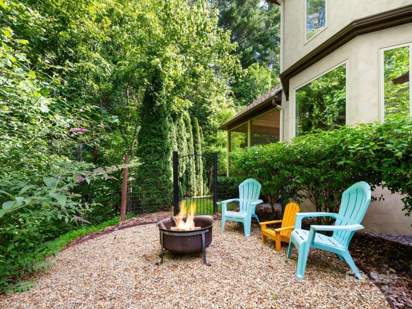 102 Gap Creek Road, Fletcher, NC 28732.  MLS# CAR4275624, YatesRealty ID 23580. Front of House Fire Pit and Backyard Access