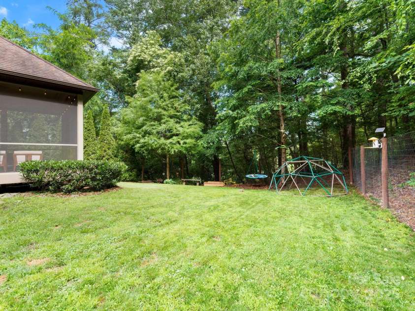 102 Gap Creek Road, Fletcher, NC 28732.  MLS# CAR4275624, YatesRealty ID 23580. Large Flat Open Backyard. Perfect for Gardening, Pets, &/Or Kids.
