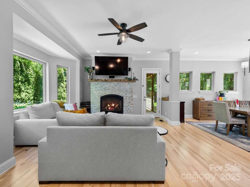 102 Gap Creek Road, Fletcher, NC 28732.  MLS# CAR4275624, YatesRealty ID 23580. Main Living Room Looking Shining with All the Natural Light of Picture Style Windows w/ that Hidden Oasis Mountain View.